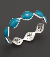 Summer-blue enamel drops over a carved sterling silver bangle By Elizabeth Showers.