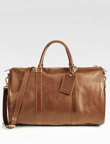For the gentleman who prefers to travel in style, this sophisticated duffel crafted in calfskin leather features a a removable shoulder strap, an interior pocket and a luggage tag.Zip closureDouble top handlesRemovable shoulder strapLeather20W x 11H x 9DImported For the gentleman who prefers to travel in style, this sophisticated duffel crafted in calfskin leather features a a removable shoulder strap, an interior pocket and a luggage tag.Zip closureDouble top handlesRemovable shoulder strapLeather20W x 11H x 9DImported