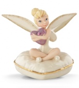 The fairest pixie of them all, Tinker Bell clutches a sparkling purple heart on a similarly shaped cushion in this limited-edition Disney figurine. Beautiful glazed and gold detail enriches already-elegant Lenox fine china.