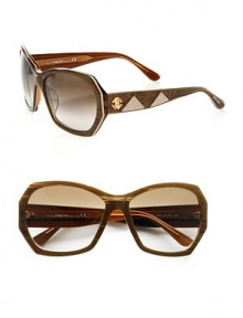 These modern, acetate frames feature two-tone leather inset temples. Available in brown striped with brown gradient lens. Leather inset logo temples100% UV protectionMade in Italy These modern, acetate frames feature two-tone leather inset temples. Available in brown striped with brown gradient lens. Leather inset logo temples100% UV protectionMade in Italy