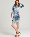 An abstract multicolored print and draped neckline impart bold style to this figure-conscious Three Dots dress.