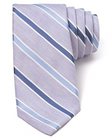 A fine blend of soft linen and plush silk harmonize together on this handsome tie, featuring a refreshing light stripe design that pairs perfectly with your warm weather suiting. A fine blend of soft linen and plush silk harmonize together on this handsome tie, featuring a refreshing light stripe design that pairs perfectly with your warm weather suiting.