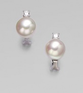 A classic design with a hint of sparkle for a truly versatile piece. 12mm round white organic man-made pearlsCubic zirconiaSterling silverSize, about ¼Post backImported 