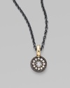 A circle of sparkling diamonds hangs from an oxidized sterling silver chain.Diamonds, .1 tcw Oxidized sterling silver 14k yellow gold Length, about 16 Pendant diameter, about ½ Spring ring clasp Made in USA