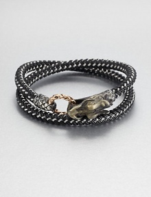 From the Naga Collection. A bold, braided strand of black nylon cord wraps the wrist twice, then clasps with a woven bronze ring and a Naga dragon hook of sterling silver.NylonSterling silver and bronzeStrap width, about .25Diameter, about 2.5Hook-and-ring closureMade in Bali From the Naga Collection. A bold, braided strand of black nylon cord wraps the wrist twice, then clasps with a woven bronze ring and a Naga dragon hook of sterling silver.NylonSterling silver and bronzeStrap width, about .25Diameter, about 2.5Hook-and-ring closureMade in Bali