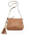 A sleek crossbody with polished appeal. This gorgeous design by Vince Camuto features a playful tassel charm, pretty goldtone hardware and a chic chain detailed strap.