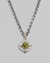 Chic little accent in gleaming sterling silver and 18k gold, centered with a smooth cabochon peridot stone. Chain sold separately About ½ diam Imported