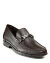 The classic loafer rendered in fine Italian leather and adorned with Salvatore Ferragamo's signature gancini logo bit detail at across the tongue.