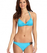 THE LOOKTwisted detailing at frontHalter straps tie at neckLined soft cupsBack tie closure with bead accentsTHE MATERIAL80% nylon/20% spandexFully linedCARE & ORIGINHand washMade in USAPlease note: Bikini bottom sold separately. 