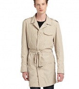 THE LOOKShirt collarConcealed front button closureLong button cuff sleeves with zipper accentEpaulettesSeam detailsFlap chest pocketPerforated under arm detailsSide zip pocketsSelf-tie belt with buckle accentBack gun flapBack vented hemOne inside zip pocketTHE MATERIALPolyesterPartially linedCARE & ORIGINDry cleanMade in Italy