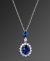 Look perfectly regal at your next red carpet event. This royalty-inspired pendant by CRISLU features pear-cut and oval-cut sapphire-colored cubic zirconias surrounded by a halo of round-cut clear cubic zirconias (5-1/3 ct. t.w.). Set in platinum over sterling silver. Approximate length: 16 inches. Approximate drop: 1-1/8 inches.