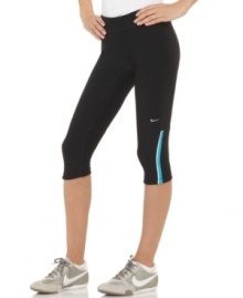 Sporty style and high performance technology come together in these capri active pants from Nike. Sporty style and high performance technology come together in these capri active pants from Nike.
