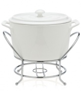 At once elegant and utilitarian, the Cucina warmer transitions flawlessly from oven to table and will keep your food piping hot, set in a silvertone metal rack. A must for the consummate host, from Godinger.