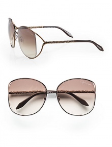 A chic metal style with intricately detailed temples and modern floating lens. Available in brown with brown gradient lens. Logo etched lens100% UV protectionMade in Italy A chic metal style with intricately detailed temples and modern floating lens. Available in brown with brown gradient lens. Logo etched lens100% UV protectionMade in Italy