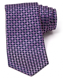 Decadently patterned and teeming with sheen, this luxurious silk tie from Ike Behar puts a new spin on classic refinement with bedazzling squares. Decadently patterned and teeming with sheen, this luxurious silk tie from Ike Behar puts a new spin on classic refinement with bedazzling squares.