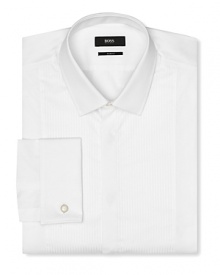Slim fit tuxedo dress shirt with intricate pintuck detail in front. Covered placket except top button showing, tonal textured stripes. Small point collar. French cuffs. Slim fit tuxedo dress shirt with intricate pintuck detail in front. Covered placket except top button showing, tonal textured stripes. Small point collar. French cuffs.