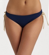 Sleek stretch nylon knit with soft ruching and contrast side ties.Elastic waistband Side ruching with contrast ties Fully lined 80% nylon/20% spandex Fully lined Hand wash Made in USAPlease note: Bikini top sold separately. 
