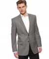 Sharp style with details you can own. Finish off your work look with this Calvin Klein blazer.