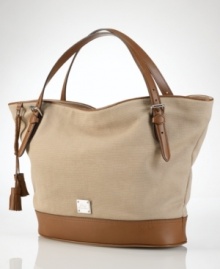 A perfect blend of cool, casual cotton canvas and rich leather accents, this roomy and versatile tote from Lauren by Ralph Lauren is an everyday essential infused with haute style. A perfect blend of cool, casual cotton canvas and rich leather accents, this roomy and versatile tote from Lauren by Ralph Lauren is an everyday essential infused with haute style.