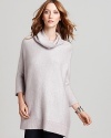 A relaxed fit Eileen Fisher knit poncho top infuses casual cool-weather looks with understated sophistication. Dolman sleeves and a draped turtleneck channel the season's stand-out trends.