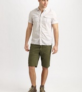 Thin contrasting stripes line this sporty design of pure cotton, featuring rolled short sleeves and front chest pockets. Button placketRolled short sleevesDual button-flap chest pocketsAbout 29½ from shoulder to hemCottonMachine washImported