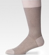 Smooth cotton knit with subtle ribbing and a handsome herringbone pattern design.Mid-calf heightLogo embroideryCottonMachine washMade in Italy
