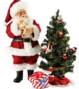 Secret Santa! His mission is complete. The gifts have been placed under the tree. Now, Santa must be on his way without waking the kids.