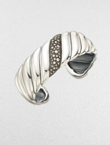 From the Cable Wrap Collection. This iconic style features a center band of pavé diamonds. Diamonds, .57 tcw Sterling silver Diameter, about 2¼ Imported 