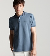 A stripe trim at the collar adds a subtle, unique touch to a classic polo from Burberry.