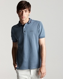 A stripe trim at the collar adds a subtle, unique touch to a classic polo from Burberry.