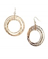 Round out your look in chic circles. Gleaming in gold tone mixed metal, Nine West's stylish drop earrings feature four graduated circles. Approximate drop: 1-1/2 inches.