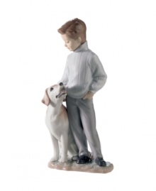Boy's best friend. A charming gift for dog owners, this handcrafted Lladro figurine features a dapper young man and his doting Labrador. Boy's best friend. A charming gift for dog owners, this handcrafted Lladro figurine features a dapper young man and his doting Labrador.