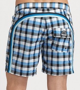 Quick-drying swim trunks, in a vivid check print, are accented by a lace-up waist and signature rainbow detail across the back and down the leg.Drawstring waistRear flap pocketInseam, about 7NylonMachine washImported