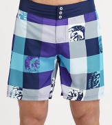 Bold, colorful plaid swim trunks with graphic detail in quick-drying nylon.Elastic waistBack flap pocketInseam, about 7PolyesterMachine washImported