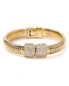 Introduce slinky chic into your jewel box with MICHAEL Michael Kors' crystal-encrusted bangle. Worn solo, this serpentine cuff makes a major impact.