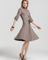 This demure yet sophisticated dress from Max & Cleo boasts textured details and a seamed skirt.