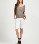 Semi-sheer v-neck with short dolman sleeves, ribbed trim and a captivating v-back. V-neckDropped shouldersShort sleevesRibbed cuffs and hemV-back65% rayon/35% LurexDry cleanImportedModel shown is 5'11 (180cm) wearing US size Small.