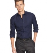 A slim-fit classic for the modern dresser. Calvin Klein's pintucked button front shirt is pitch perfect attire for the executive boardroom.