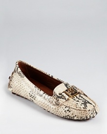 A classic driver shoe gets an exotic update in python printed leather. From Tory Burch.