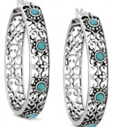 A pattern that's pleasing to the eye. Filigree adds intricate elegance to these sterling silver hoop earrings Genevieve & Grace. Synthetic turquoise accents enhance the appeal. Approximate drop: 1-7/8 inches. Approximate width: 1-3/8 inches.