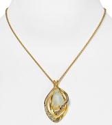 Alexis Bittar's crystal encrusted gold setting perfectly presents a beautiful pale green stone. The asymmetrical pendant deserves a permanent place in your jewelry rotation.