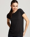 A sleek Vince boat neck top steps in for the basic tee when a dressier style is required. Flowing gently over your silhouette, it finishes in a rounded hem for polish.