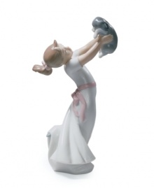 Love is in the air. An infatuated young girl hold her puppy at arm's length, taking in all his cuddly cuteness in classic Lladro porcelain. Love is in the air. An infatuated young girl hold her puppy at arm's length, taking in all his cuddly cuteness in classic Lladro porcelain.