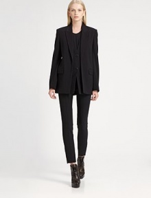 Underlying front placket adds a layered effect to this oversized wool-rich blazer. Notched collarButton placket underlayLong sleevesFront flap pocketsBack slitAbout 29 from shoulder to hemVirgin wool/nylon/LycraDry cleanImported of Italian fabricSIZE & FITModel shown is 5'10 (177cm) wearing US size 4. 