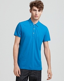 In vibrant kingfisher blue, this classic Burberry polo offers iconic style that's simultaneously modern and classic.