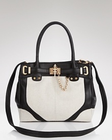 Rachel Zoe gives the lady-about-town a chic reason to downsize. Boasting leather trims, gold hardware and a structured shape, this mini tote is decidedly major. Rachel Zoe gives the lady-about-town a chic reason to downsize. Boasting leather trims, gold hardware and a structured shape, this mini tote is decidedly major.