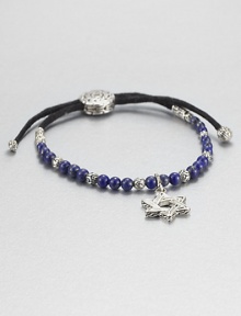 From the Batu Bedeg Collection. A beaded strand of carved silver and richly colored lapis is strung on a black fabric cord and highlighted by a stunning Star of David silver charm.LapisSterling silverAdjusts from about 6 to 9 longSliding bead closureMade in Bali From the Batu Bedeg Collection. A beaded strand of carved silver and richly colored lapis is strung on a black fabric cord and highlighted by a stunning Star of David silver charm.LapisSterling silverAdjusts from about 6 to 9 longSliding bead closureMade in Bali