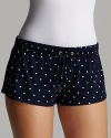 Soft sleep shorts with a drawstring waist and signature heart charm accent, a pretty polka dot look from Juicy Couture.