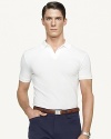 A sleek short-sleeved polo shirt in breathable mercerized stretch cotton piqué is cut for a trim, modern fit that channels timeless preppy athleticism.