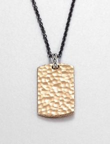 From the Palu Collection. The hand-hammered design motif of the Palu collection distinguishes a bronze dog tag pendant, connected by a sterling silver bale to a bold chain of blackened stainless steel.Bronze and sterling silverStainless steelChain length, about 24Pendant, about 2L X 1WLobster claspMade in Bali From the Palu Collection. The hand-hammered design motif of the Palu collection distinguishes a bronze dog tag pendant, connected by a sterling silver bale to a bold chain of blackened stainless steel.Bronze and sterling silverStainless steelChain length, about 24Pendant, about 2L X 1WLobster claspMade in Bali